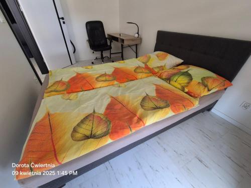 Un ou plusieurs lits dans un hébergement de l'établissement Apartament Sun Tower z Parkingiem