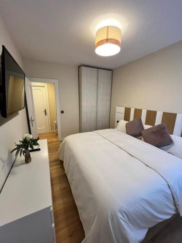 Ένα ή περισσότερα κρεβάτια σε δωμάτιο στο Casa Elso Pamplona