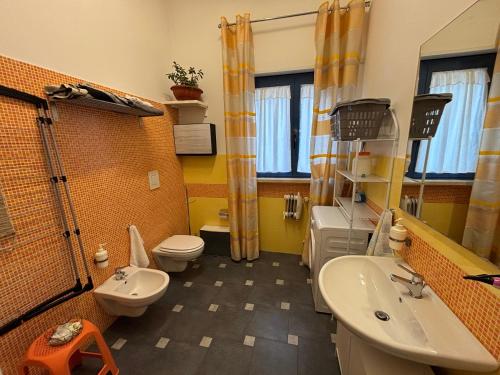 a bathroom with a sink and a toilet and a shower at La rosa di Rebecca in Monopoli