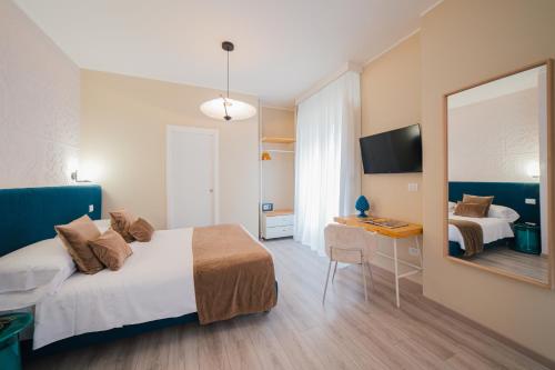 Una cama o camas en una habitación de A'Coffa Rooms