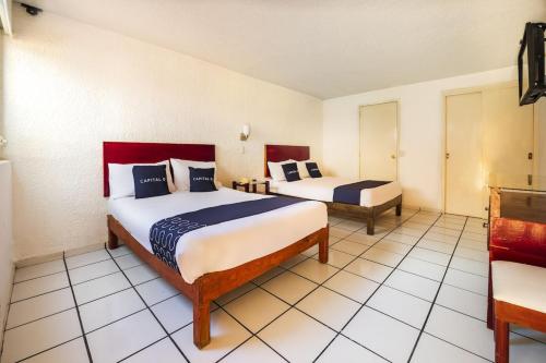 Cama o camas de una habitación en Capital O Colón, Ciudad Guzmán Jalisco