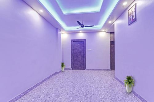 an empty room with a door and a ceiling at Hotel O Saharsh Hotel in Patna