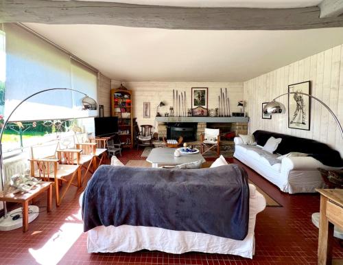 En eller flere senge i et værelse på Maison familiale au cœur du golf de Cornouaille