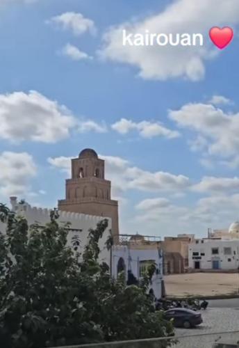 a building with a red heart in the sky at Dar manena in Kairouan