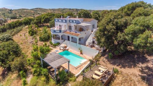 an aerial view of a house with a swimming pool at Elegant villa, beautiful ocean view, natural paradise! in Tavira