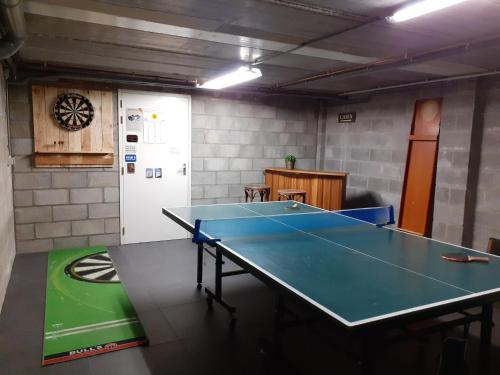 a ping pong room with a ping pong table at La Bordure de la Forêt in Sourbrodt