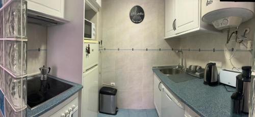a kitchen with a sink and a counter top at Central Calpe, 4min walk to the beach in Calpe
