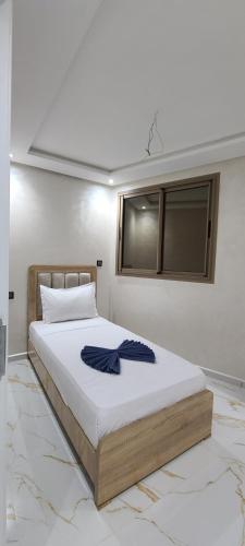Postel nebo postele na pokoji v ubytování appartment igar azougagh elhoceima