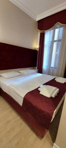 Postel nebo postele na pokoji v ubytování BOSS To HOTEL TAKSİM