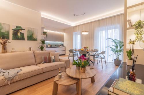 a living room with a couch and a table at Sweet Home 23 in Campagnano di Roma