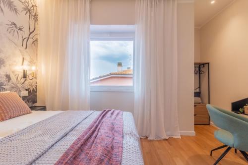a bedroom with a bed and a window at Sweet Home 23 in Campagnano di Roma