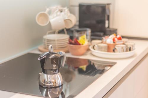 a coffee maker sitting on a counter in a kitchen at Sweet Home 23 in Campagnano di Roma