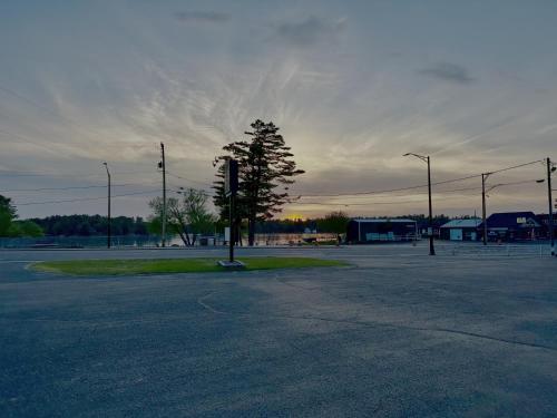 an empty parking lot with a traffic light in an intersection at Aqua Aire Inn & Suites in Minocqua