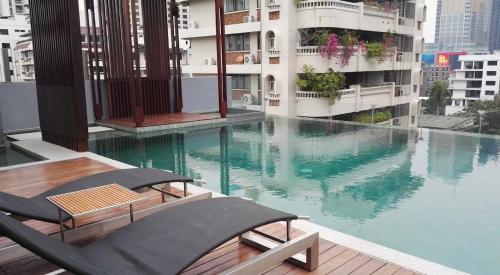 a swimming pool on the roof of a building at 4Pax MRT BTS Asoke, Terminal21 in Bangkok