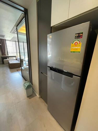 a stainless steel refrigerator in a room at 4Pax MRT BTS Asoke, Terminal21 in Bangkok