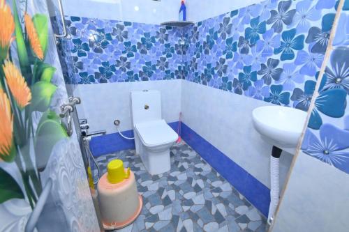 a small bathroom with a toilet and a sink at Gods Gift homestay, murdeshwar in Māvalli