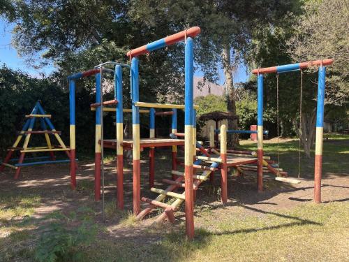 a park with a playground with a swing set at Elqui Antu in Vicuña