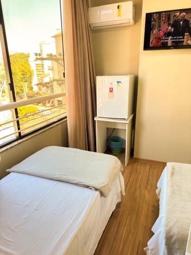 Katil atau katil-katil dalam bilik di Estação Termas Hotel