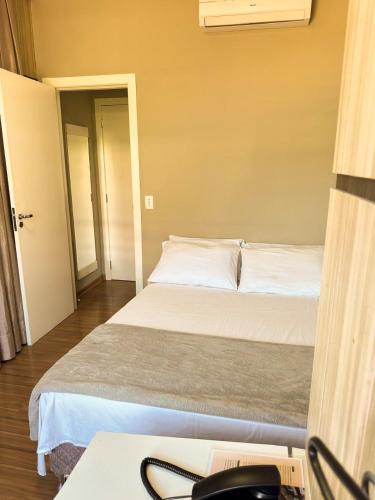 Katil atau katil-katil dalam bilik di Estação Termas Hotel