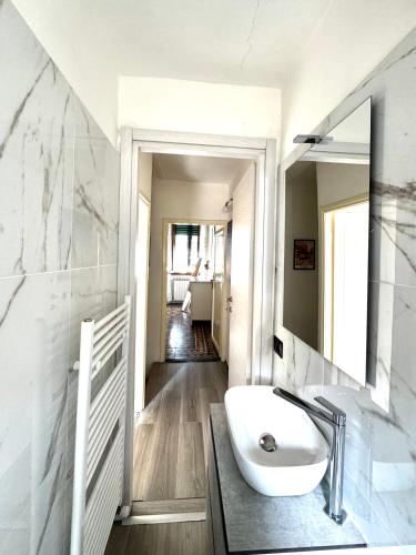 a bathroom with a sink and a mirror at Accommodation near the airport in Florence