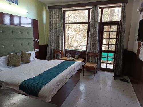 Katil atau katil-katil dalam bilik di Hotel Ashiana Regency
