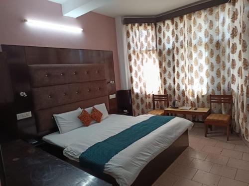 Katil atau katil-katil dalam bilik di Hotel Ashiana Regency
