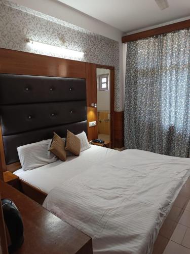 Katil atau katil-katil dalam bilik di Hotel Ashiana Regency