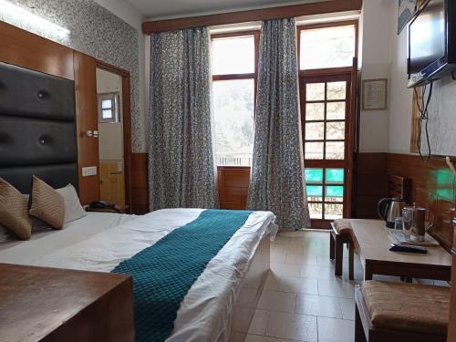 Katil atau katil-katil dalam bilik di Hotel Ashiana Regency