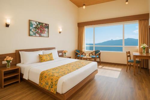 a hotel room with a bed and a large window at Summit Namnang Courtyard & Spa Near Mg Marg in Gangtok