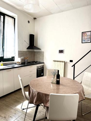a kitchen with a table and chairs in a room at Accommodation near the airport in Florence