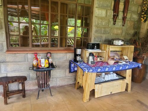a kitchen with a table and a counter top at Edaala Comfort - B&B in Nairobi