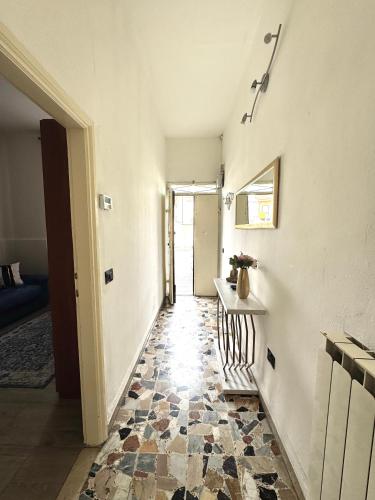 a room with a hallway with a tile floor at Accommodation near the airport in Florence