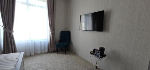 TV a/nebo společenská místnost v ubytování Boutique Hotel
