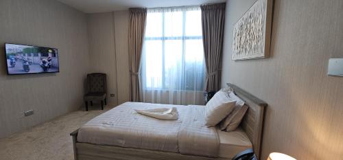 Postel nebo postele na pokoji v ubytování Boutique Hotel