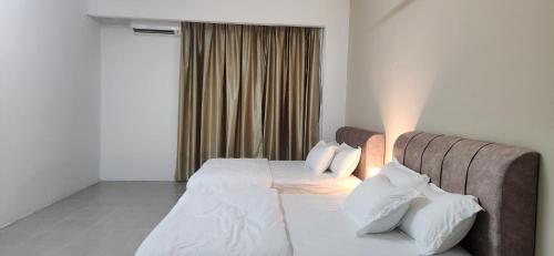 Una cama o camas en una habitación de LestariHome2, KLIA Sepang