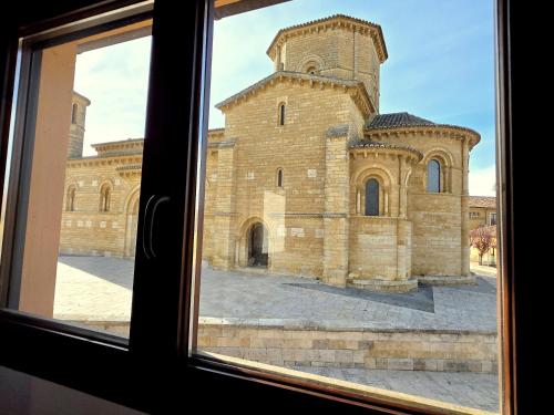 a view of a building from a window at Vivienda Camino de San Martin in Frómista