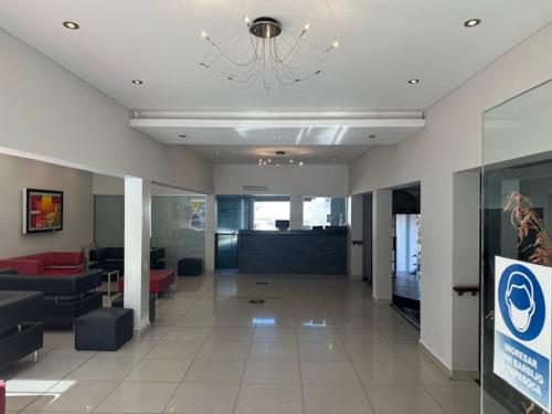 a large lobby with a chandelier in a building at Hotel Nuevo Enzo in Villa Carlos Paz