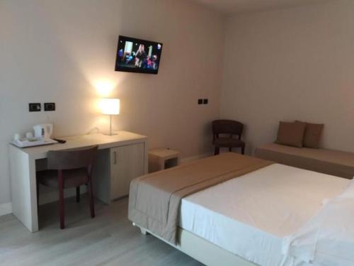 Letto o letti in una camera di Hotel Villa Barsanti