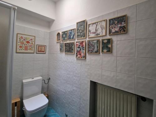 a bathroom with a toilet and a fireplace at Acquadolce in Salò