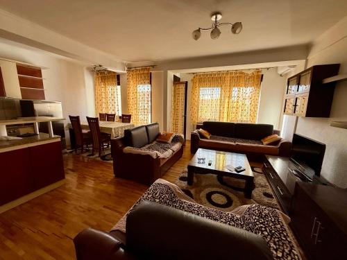 a large living room with couches and a table at City Square Apartment 1st floor in Strumica