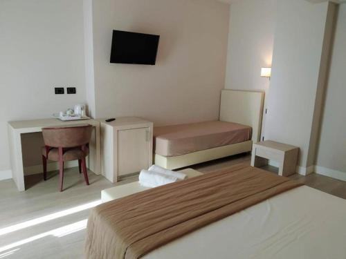 Letto o letti in una camera di Hotel Villa Barsanti
