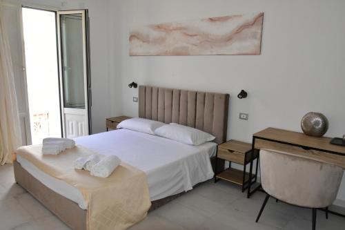 Postel nebo postele na pokoji v ubytování Yllen Rooms