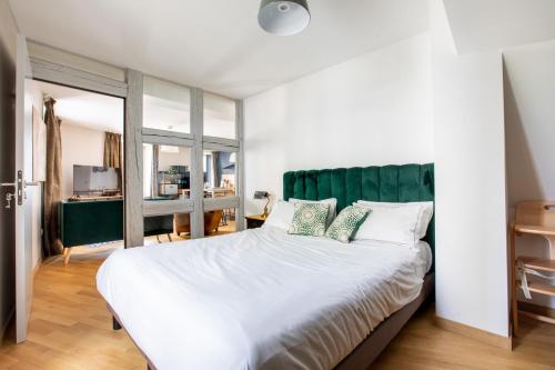 Ένα ή περισσότερα κρεβάτια σε δωμάτιο στο Appartement de l'Arsenal