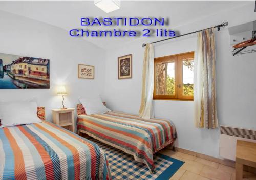 Ein Bett oder Betten in einem Zimmer der Unterkunft Domaine L'Helion