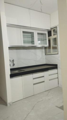 Η κουζίνα ή μικρή κουζίνα στο Furnished Apartment in Pune