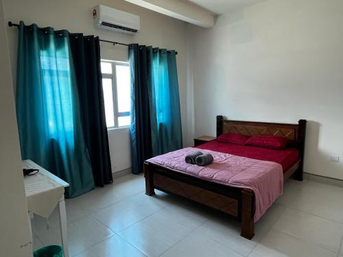 Кровать или кровати в номере Homestay Adyana
