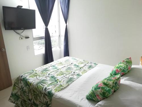 Ein Bett oder Betten in einem Zimmer der Unterkunft En conjunto 10 min Centro Evento Valle del Pacifico
