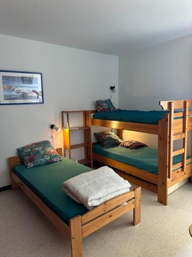 Cette chambre comprend deux lits superposés et est reconnue par estosbestosbestosbestosbestosbestosbestosbestosbestosbestos. dans l'établissement Gaïa, au Barcarès