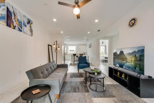 a living room with a couch and a tv at Metro View 2BR I Parking I King Bed I Workspace in Dallas