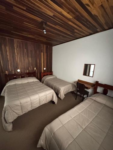 Ein Bett oder Betten in einem Zimmer der Unterkunft Pousada Pinheiro Real